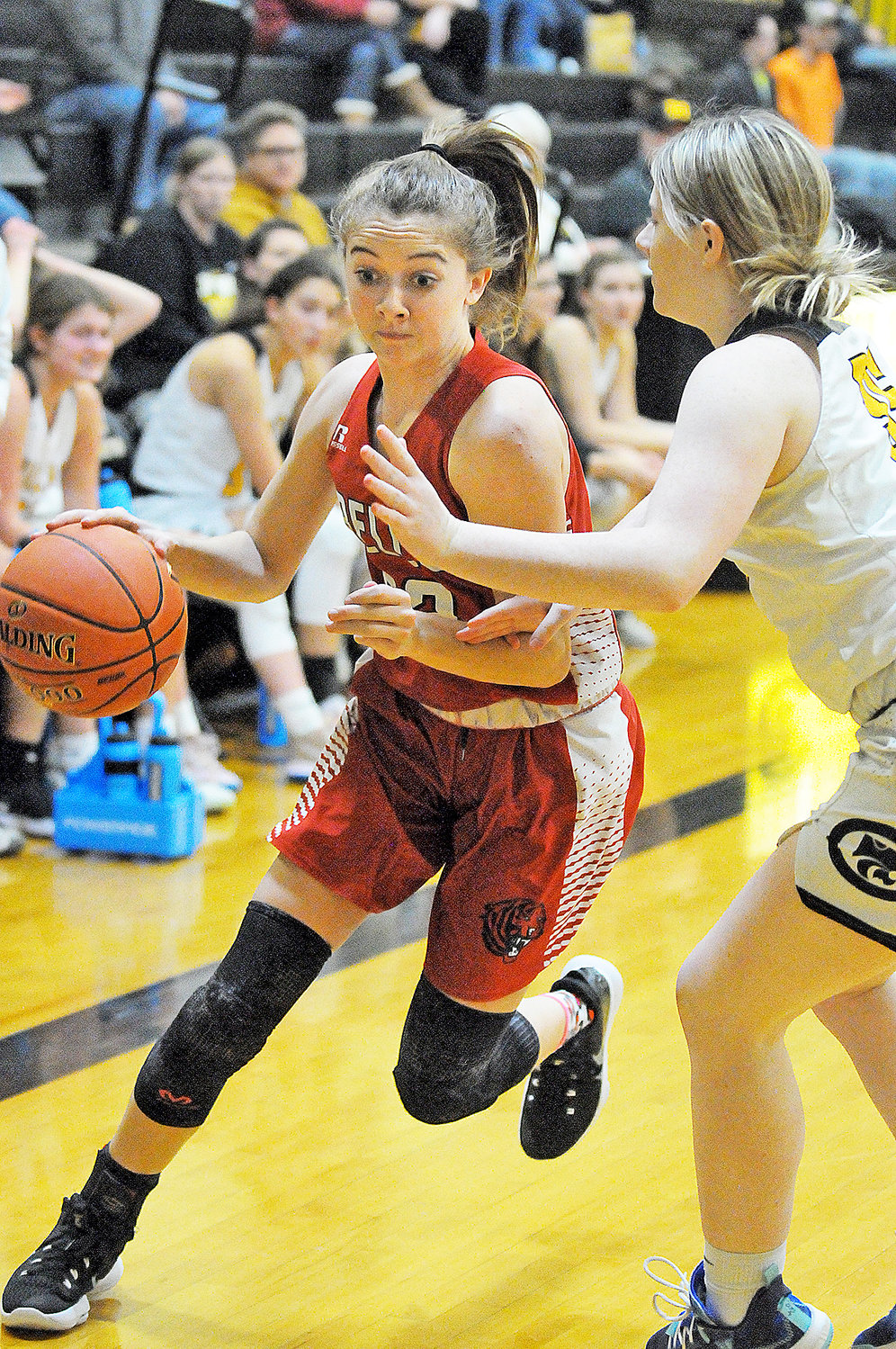 Nevaeh Kinsey (left) drives past a Cuba defender during Gasconade Valley Conference (GVC) basketball action Thursday night on the road in Crawford County.